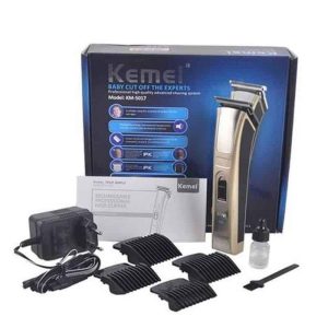 Kemei KM-5017 hair clipper with its box, charger, 4 guide combs, blade oil and brush